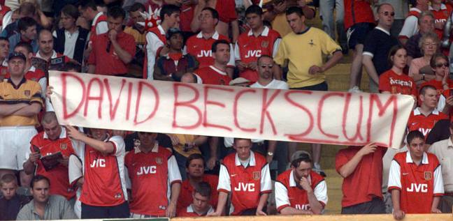 Arsenal fans with a banner reading &quot;DAVID BECKSCUM&quot; (Alamy)