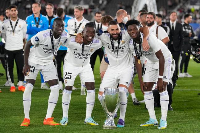 Ferland Mendy, Eduardo Camavinga, Karim Benzema, and Aurelien Tchouameni celebrate with the UEFA Super Cup. (Image Credit: Alamy)