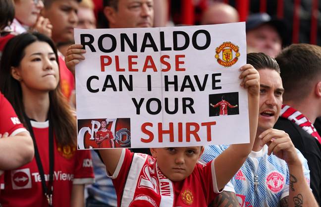 A young United fan attempts to get Ronaldo's shirt. Image: PA Images