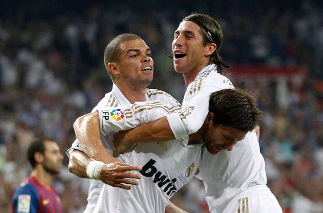 Sergio Ramos grabs Xabi Alonso while celebrating with Pepe. (Image Credit: Alamy)