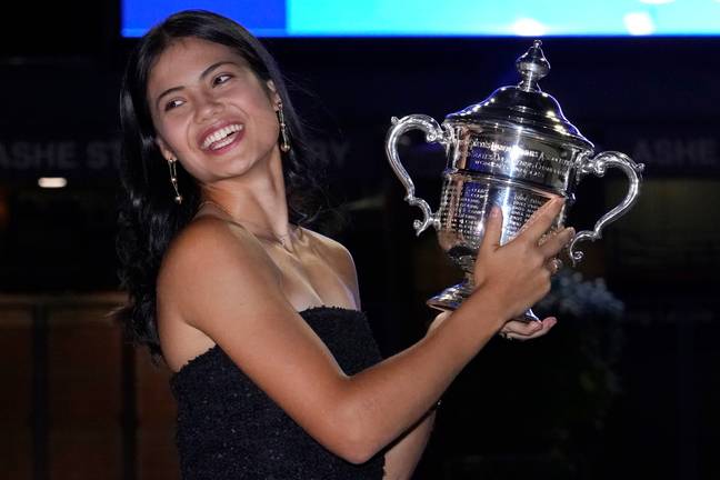 Raducanu celebrates with her trophy. Image: PA Images