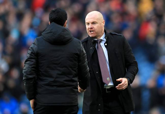 Dyche shakes hands with Arteta. 