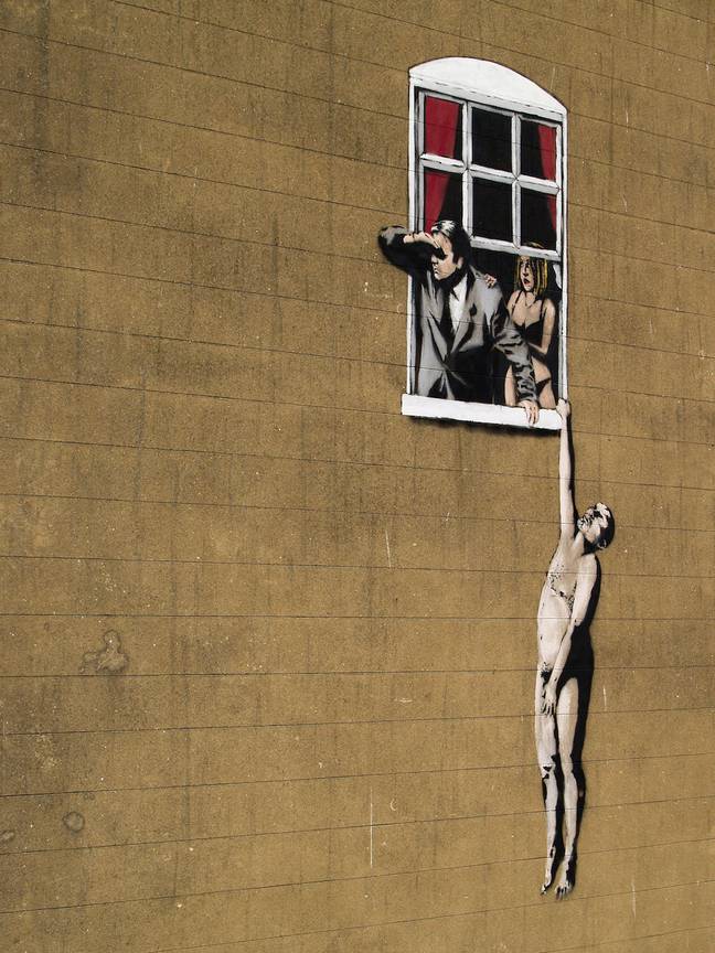A graffiti design by the mysterious Banksy in Bristol, England. Credit: Alamy