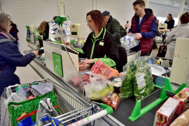 Asda shoppers are reportedly stopping staff from scanning their items half-way through checkout because they can't afford more. Credit: Alamy