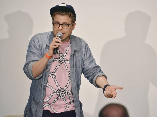 Adam Conover on stage at The Comedy Comedy Festival. Credit: Alamy