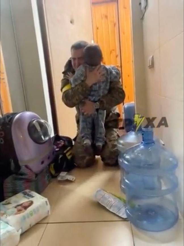 The sweet clip shows the adorable tot running up to the front door as his father walks in wearing his Ukrainian army uniform (Reddit u/Impossible-Reach-965 / TPXA).