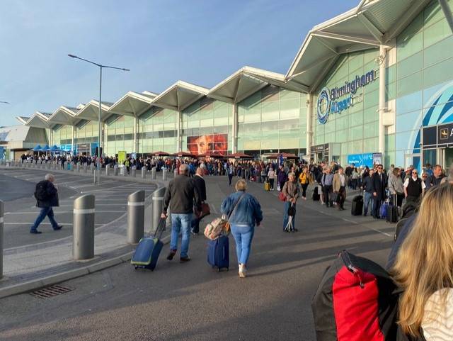 Thousands queued up outside Birmingham Airport this morning. Credit: BPM Media