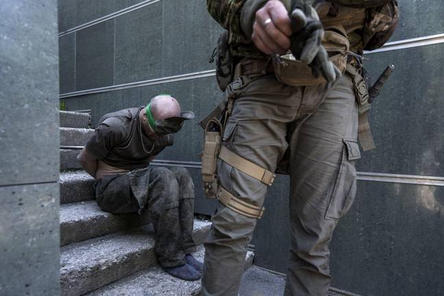 A Russian soldier being captured by Ukrainian forces. Credit:  UPI / Alamy Stock Photo