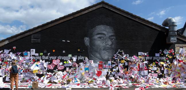 A mural of Marcus Rashford in Manchester was covered in supportive messages after it was vandalised with racist graffiti. Credit: Alamy