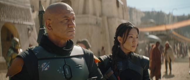 (L-R): Temura Morrison is Boba Fett and Ming-Na Wen is Fennec Shand in Lucasfilm's THE BOOK OF BOBA FETT, exclusively on Disney+. © 2021 Lucasfilm Ltd. &amp; ™. All Rights Reserved.