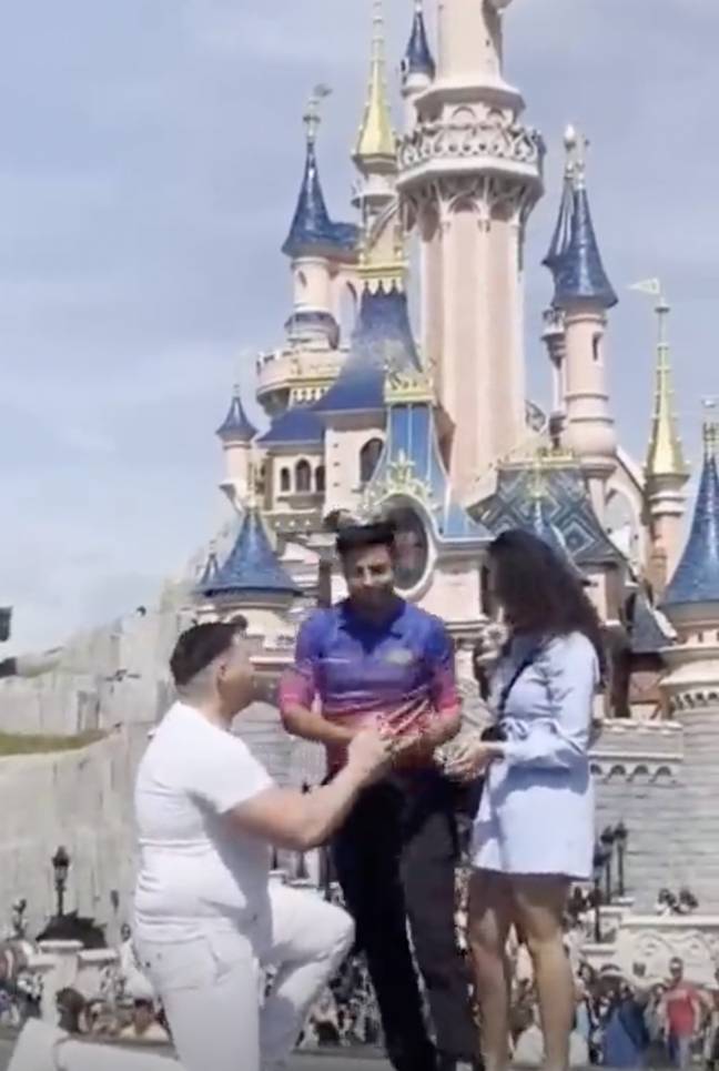 The proposal was 'ruined' by the employee, who swiftly directed the couple to another area. Credit: YouTube