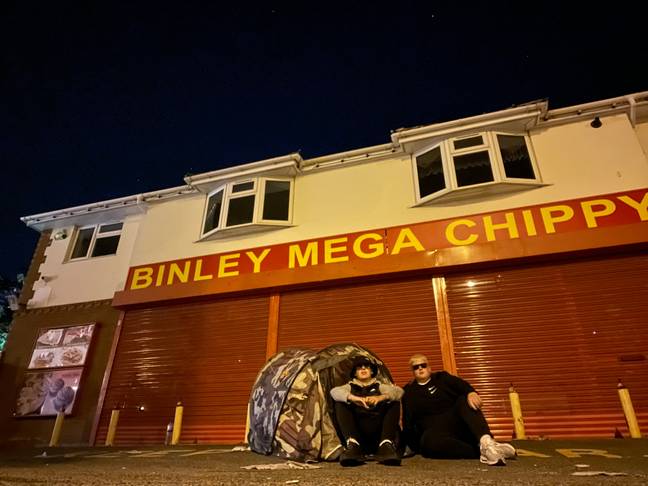 Ethan and Oscar camped outside the popular takeaway. Credit: LADbible