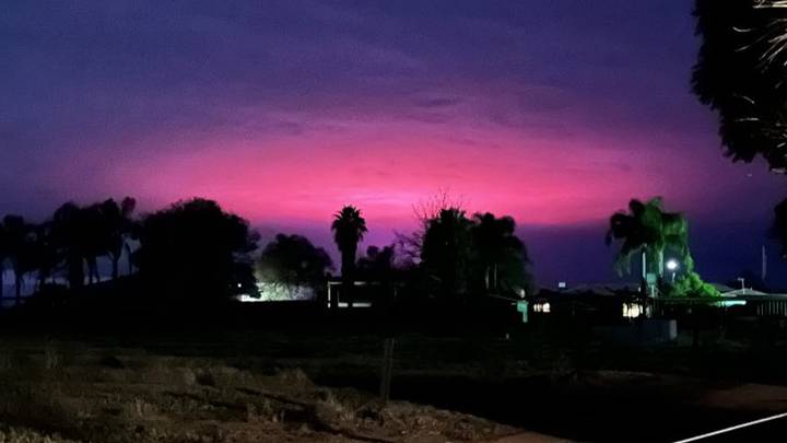 Mysterious Stranger Things Like Pink Glow Illuminates Sky Above Town