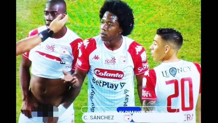 Fans stunned after footballer pulls down his shorts and exposes his manhood while defending a free-kick