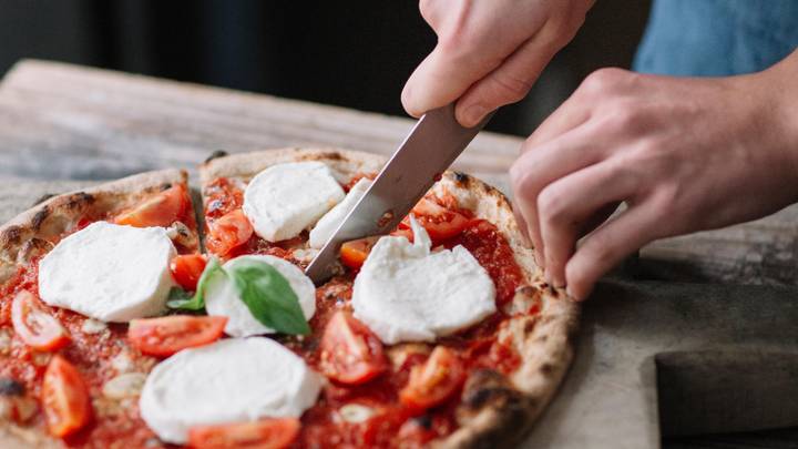 Woman Sparks Debate After Revealing What She Uses To Cut Pizza