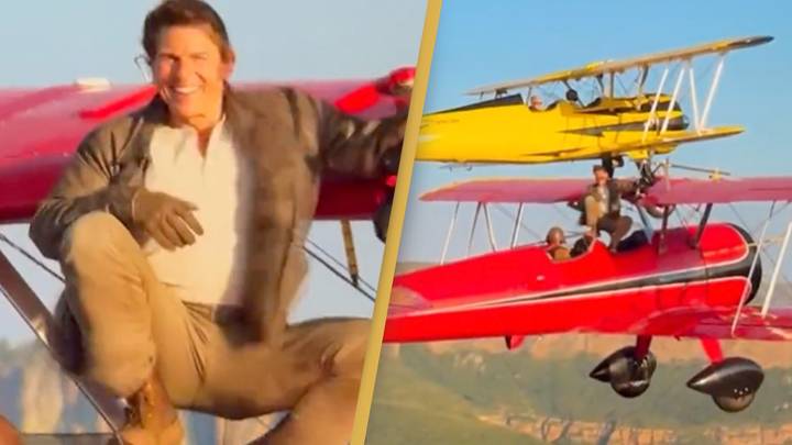 Tom Cruise casually sends scary message to fans while hanging off the top of an aeroplane