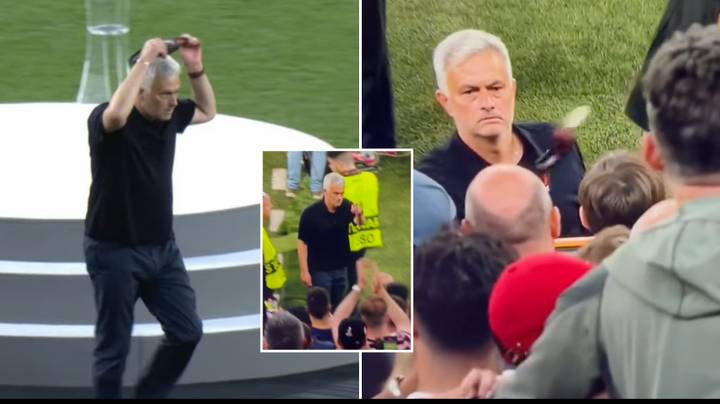 AS Roma manager Jose Mourinho throws his Europa League runners-up medal  into the crowd