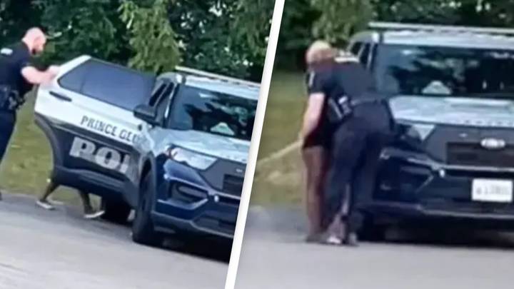 Police officer suspended after video emerged of him kissing woman before joining her in the back of police car