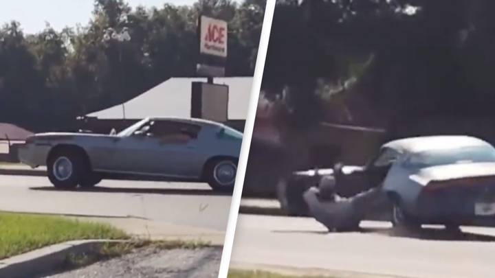 Guy nearly runs himself over after falling out of powersliding car