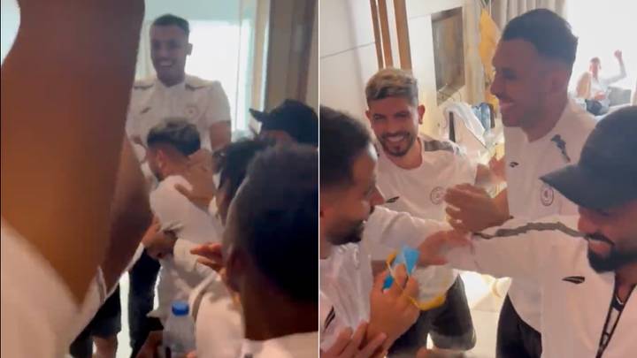 Saudi Arabian footballers celebrate with Argentine teammate Ever Banega