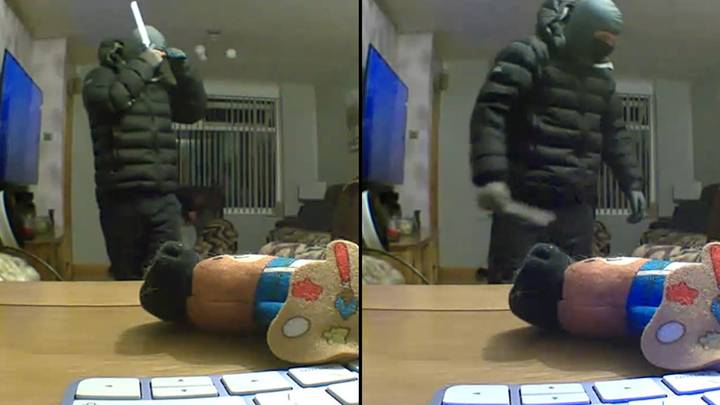 Chilling moment man with balaclava and knife wanders into family's living room