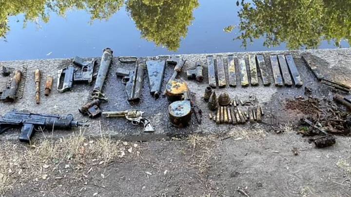 Family finds Uzi machine gun among huge haul of weapons in London river