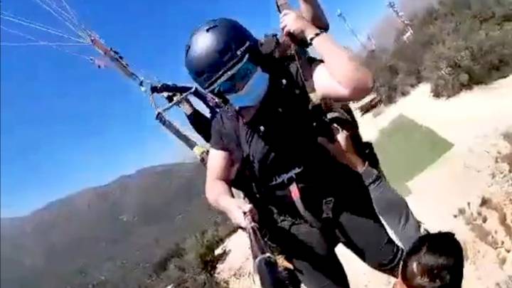 Shocking Moment Man Is Left Dangling By His Hands From Paraglider