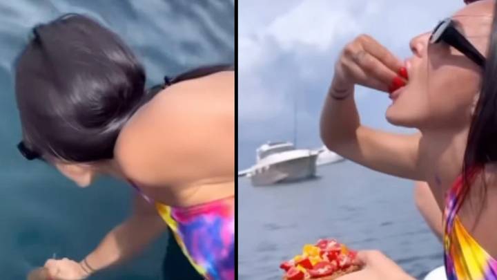 Woman horrifies people by dipping her lunch in the sea to add extra flavour