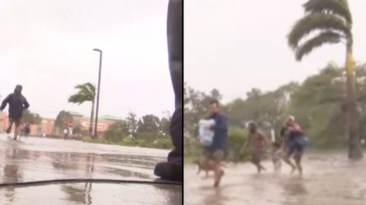 Cameraman drops his camera during live broadcast to help people fleeing to safety during Hurricane Ian