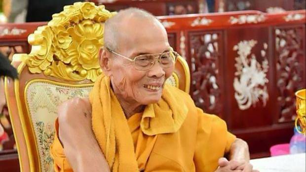 Buddhist Monk Pictured 'Smiling' As Body Is Exhumed Two Months After Death