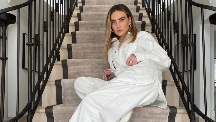 People Spot 'Cleaner' Standing At Top Of Perrie Edwards' Photo