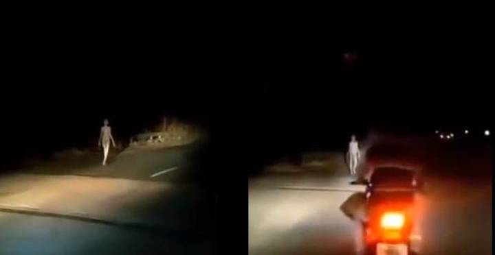 Strange 'Humanoid Alien Creature' With Long Limbs Spotted Walking Beside Road At Night