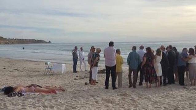 Woman Pictured Sunbathing Metres Away From A Wedding In Australia