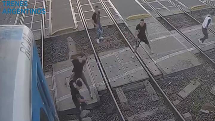 Train Narrowly Misses Group After Huge Brawl Erupts On Railway Tracks
