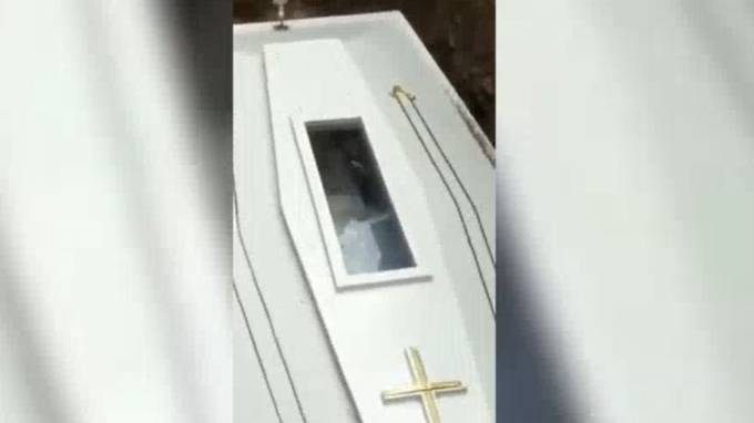 Footage Captures Bizarre Moment Corpse Appears To Wave In Coffin