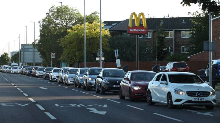 Cars Queue Down The Street As McDonald's Restaurants Reopen For Drive-Thru