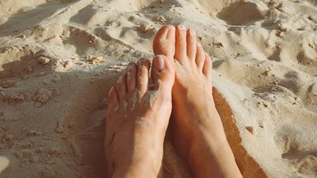 Woman Shares Genius Hack To Get Sand Off Your Feet in Seconds