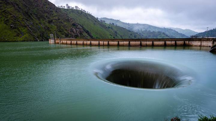 Incredible 75ft Wide ‘Portal From Hell’ Opens In Lake With A 200ft Drop