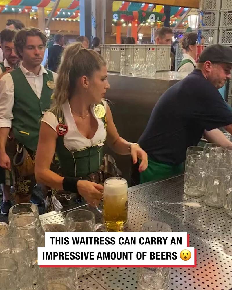 Waitress carries impressive ammount of steins Oktoberfest