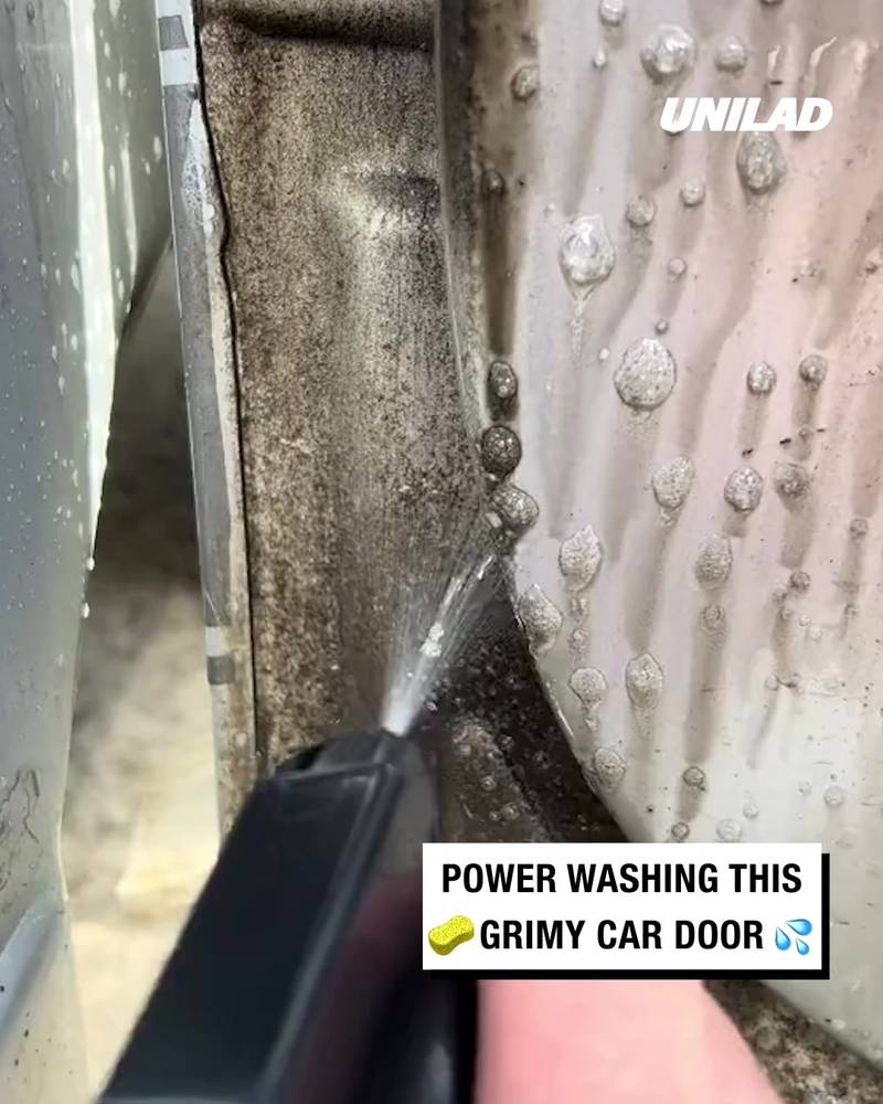 Power washing dirty car door jamb