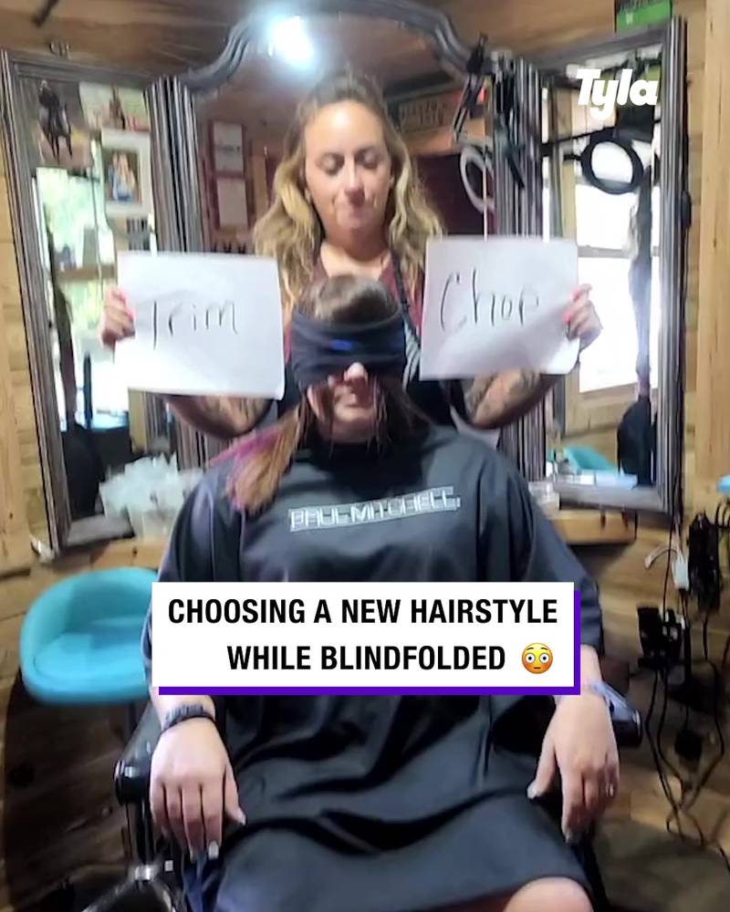 Hair stylist blindfolds her client as she picks her new hairstyle