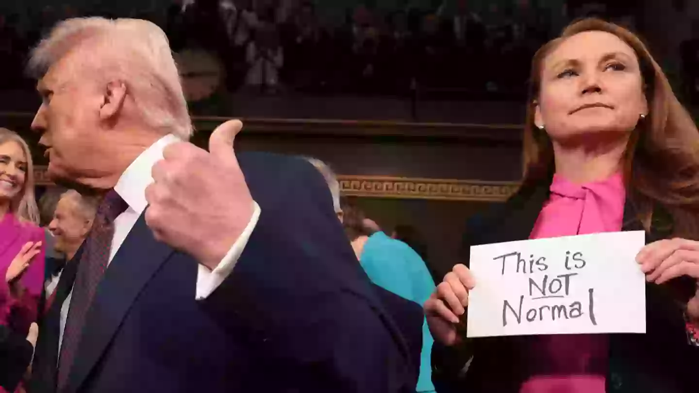 Sign Ripped Off Moment 'this is not normal' sign is ripped out of woman's hand and ...