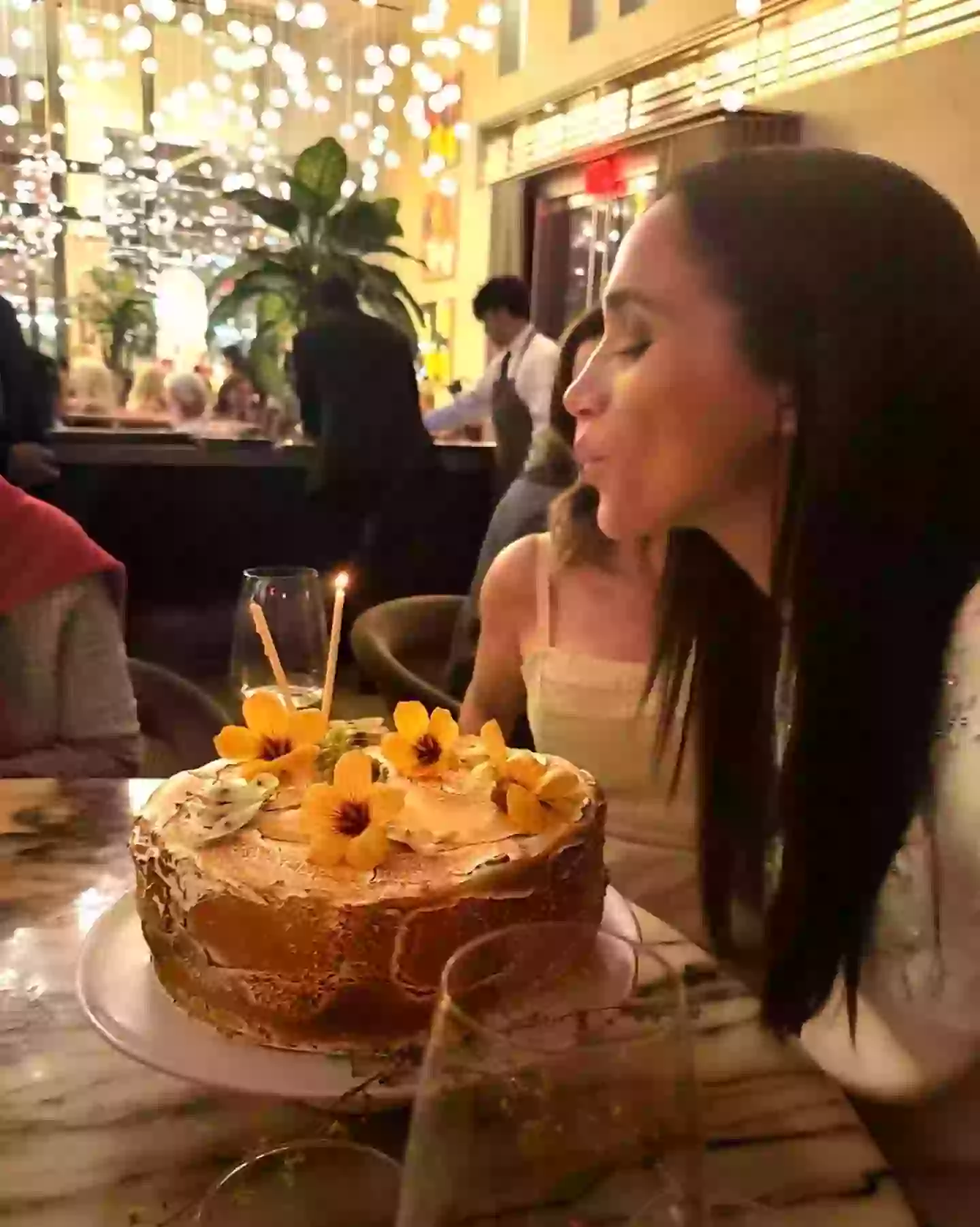 Meghan shared a photo of herself blowing out her candles (Instagram/@meghan)