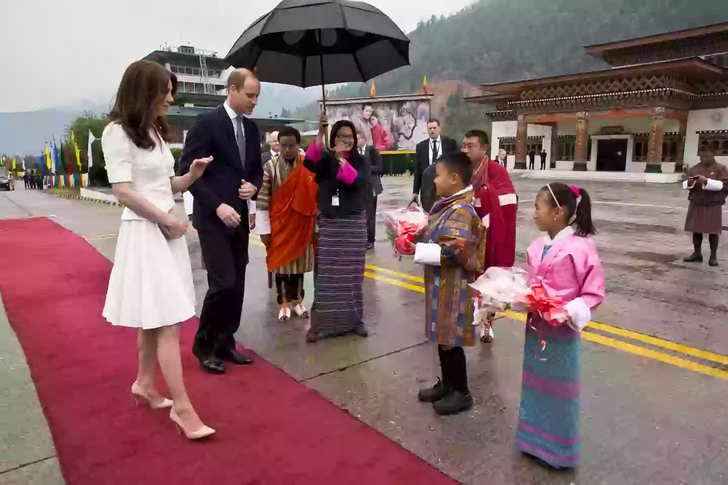 Kate and William presented with flowers as they bid farewell at Paro Airport before boarding their flight to Agra for their visit to the Taj Mahal on April 16, 2016 in Paro, Bhutan (Photo by Heathcliff O'Malley-Pool/Getty Images)