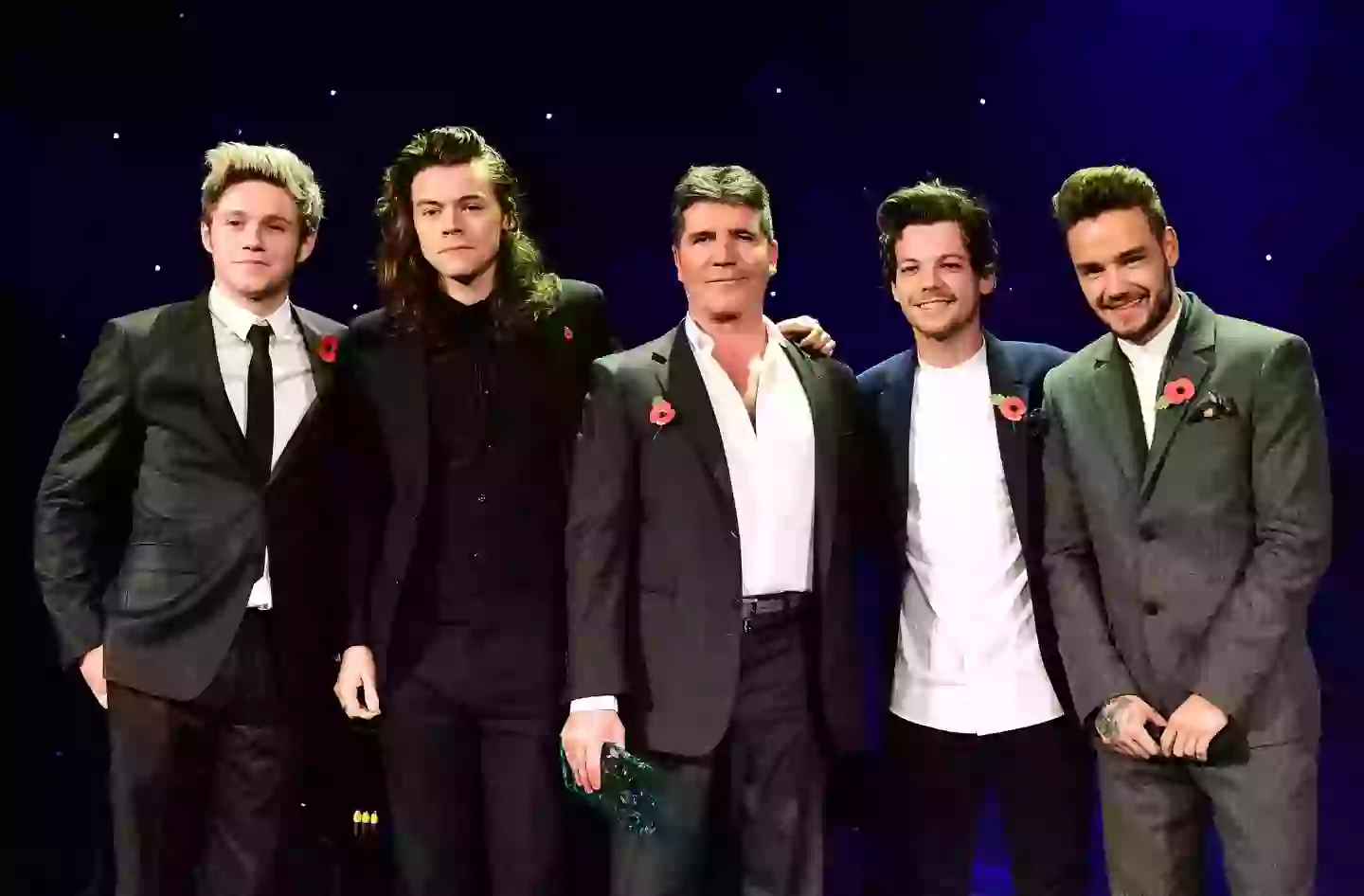 Payne with his One Direction bandmates and Simon Cowell in 2015 (PA)