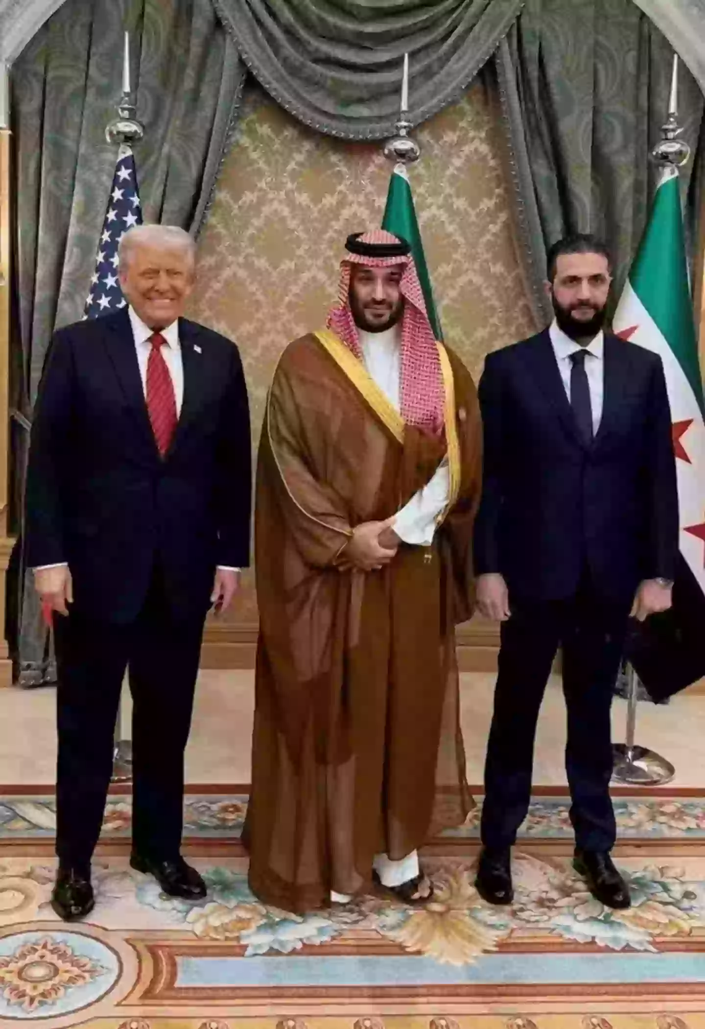 Trump posing alongside Saudi Crown Prince Mohammed Bin Salman (centre) and Syrian President Ahmed al-Sharaa in May of this year (Saudi Press Agency)
