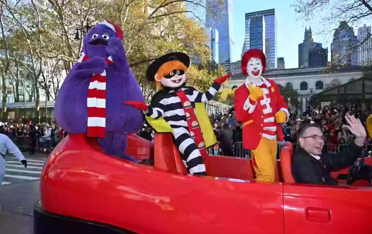 Grimace (left) with his buddies, Hambuglar and Ronald McDonald at Macy's Thanksgiving Day Parade in 2023 (James Devaney/Getty Images)