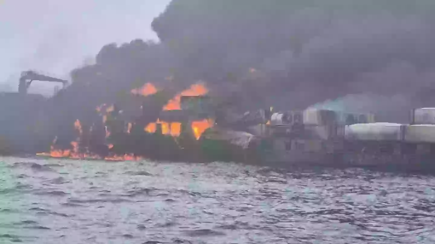 Captain of cargo ship that collided with oil tanker and burst into flames identified as Russian national