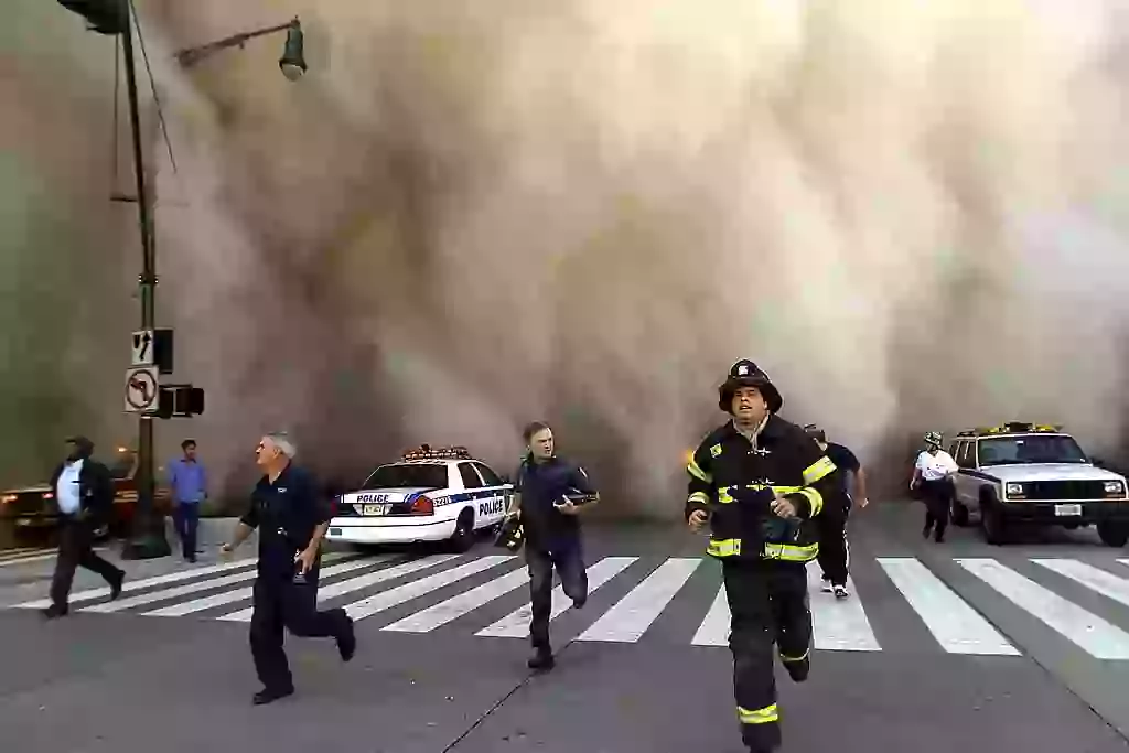 Huge plumes of dust swarmed the streets after the towers collapsed (Jose Jimenez/Primera Hora/Getty Images)