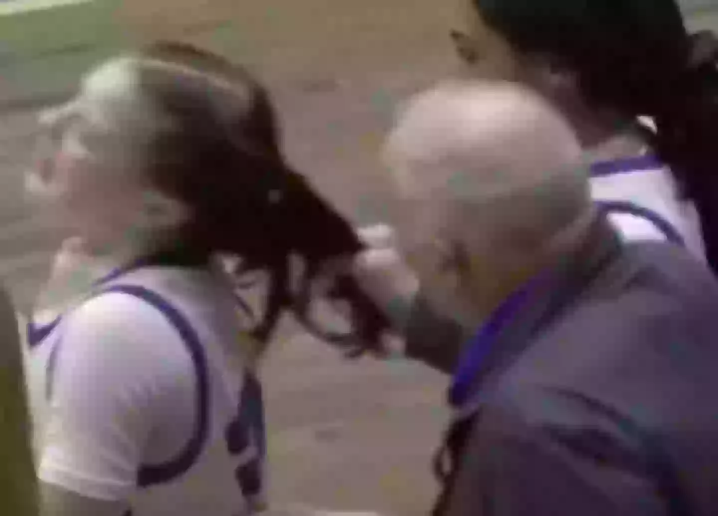 The coach pulled the players hair from behind before appearing to yell at her (YouTube/CBS6Albany)